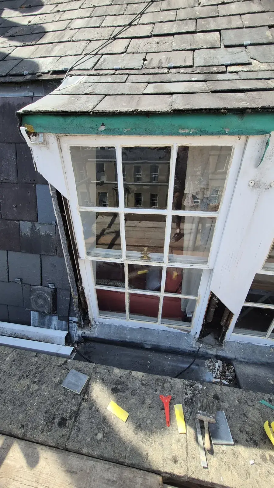 Dormer sash window stripped back with decayed timber exposed, Bath